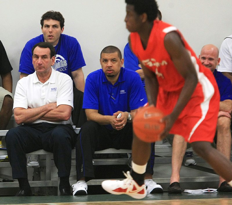 Arkansas Democrat-Gazette/STATON BREIDENTHAL --4/27/12 --  Duke basketball coach Mike Krzyzewski (left) watches a game along with other coaches Friday night during the Real Deal in the Rock tournament.