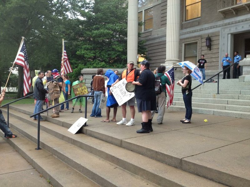 Occupy Little Rock protesters marched to City Hall on Monday afternoon in opposition of their impending eviction.