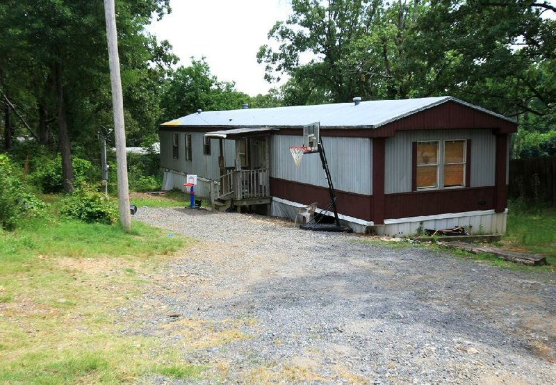 A man and a woman were found dead Sunday night in this mobile home at 7208 Reed Road in north Pulaski County. 