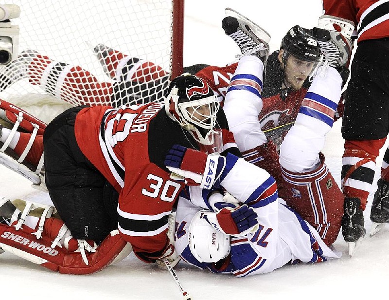 New Jersey goalie Martin Brodeur (30) had 27 saves in the Devils’ 4-1 victory over the New York Rangers on Monday in Newark, N.J. The Devils tied the Eastern Conference final series 2-2. 