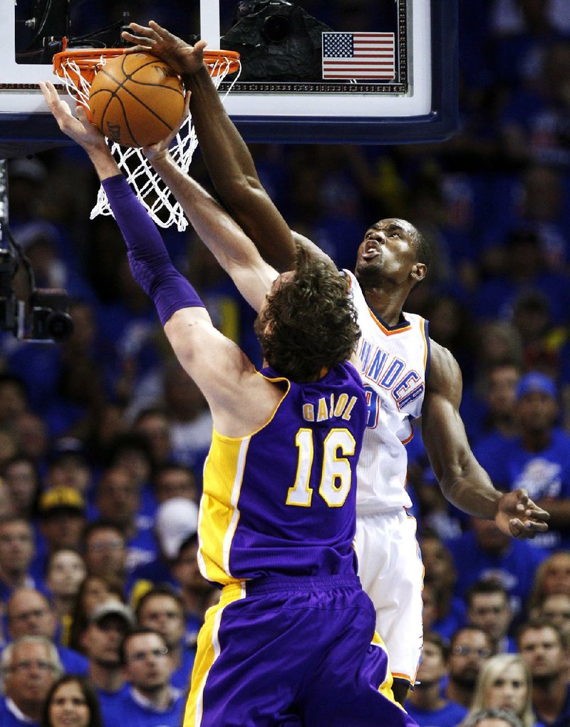 Oklahoma City foward Serge Ibaka blocks Pau Gasol’s shot during the Thunder’s 106-90 victory over the Los Angeles Lakers on Monday. 