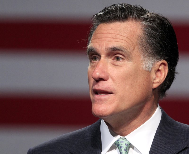 In this May 8, 2012 file photo, Republican presidential candidate, former Massachusetts Gov. Mitt Romney speaks in Lansing, Mich. Romney is looking to pad his lead in the race for convention delegates in Republican presidential primaries Tuesday in Arkansas and Kentucky as he inches closer to the nomination he's all but certain to win.