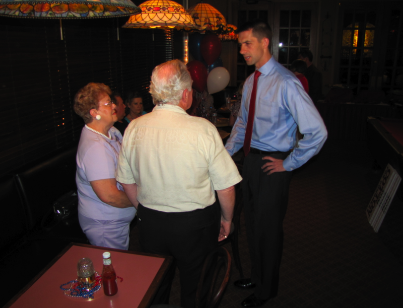 Tom Cotton talks with supporters Tuesday night at his watch party in Hot Springs.