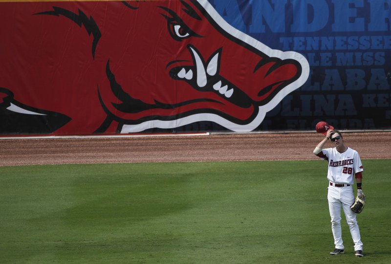Arkansas outfielder Conor Costello reacts during a six-run Mississippi State ninth inning in the first round of the Southeastern Conference tournament in Hoover, Ala on Tuesday. Mississippi State won 9-1. (AP Photo/Dave Martin)