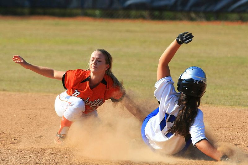  The North's Alex Tessman (17) beats the tag applied by the South's Sara Renfrow at 2nd base as she turns a single into a double after the ball got past the center fielder in the Central Arkansas Softball Classic at Little Rock Fair HIgh School Wednesday.