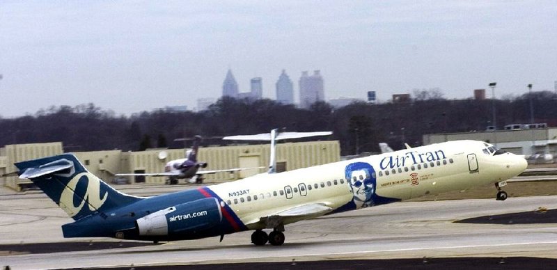 An AirTran Boeing 717 takes off from Hartsfield-Jackson Atlanta International Airport in this undated photo provided by the company. 