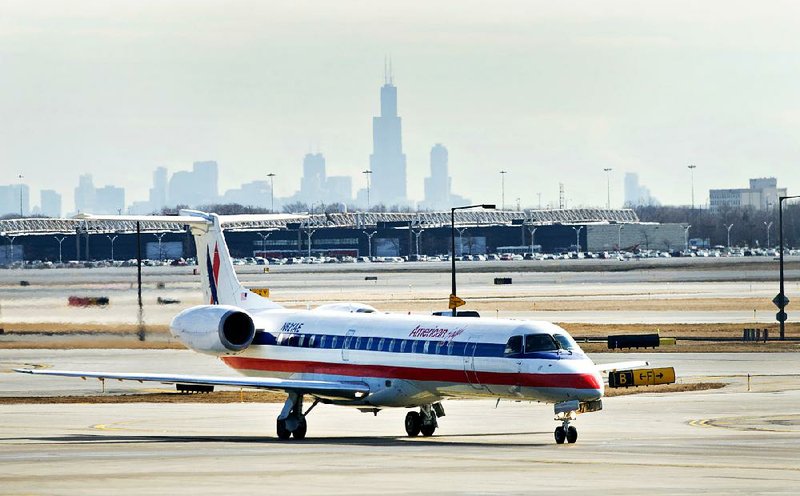 An American Airlines Embraer jet sits on the tarmac at O’Hare International Airport in Chicago in February. 