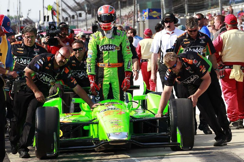 Driver James Hinchcliffe (center) is thriving as Danica Patrick’s replacement in the GoDaddy.com car and is third in the IndyCar series standings entering Sunday’s Indianapolis 500. 