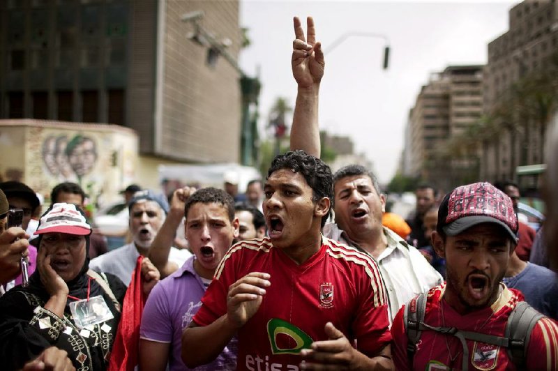 Egyptians in Cairo’s Tahrir Square protest election results that put Mubarak-era figure Ahmed Shafiq in the presidential runoff. 