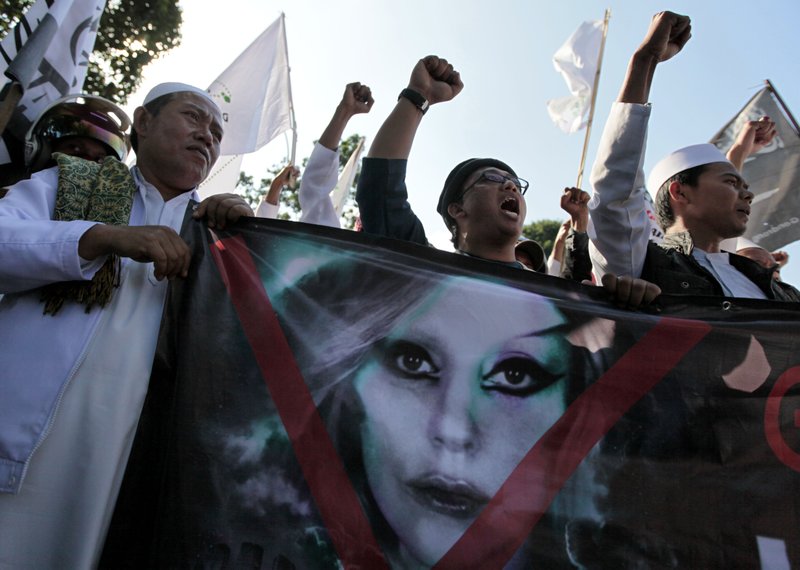 Muslim men shout slogans during a rally against U.S. pop singer Lady Gaga's concert that was scheduled to be held on June 3, outside the U.S. Embassy in Jakarta, Indonesia, Friday, May 25, 2012. 

