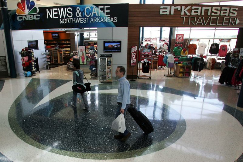 Arkansas Democrat-Gazette/RYAN MCGEENEY --04-26-2012-- XNA has recently updated its concourse, to include more comfortable furniture, higher-end restaurants and bars, and Arkansas' first moving walkway.
