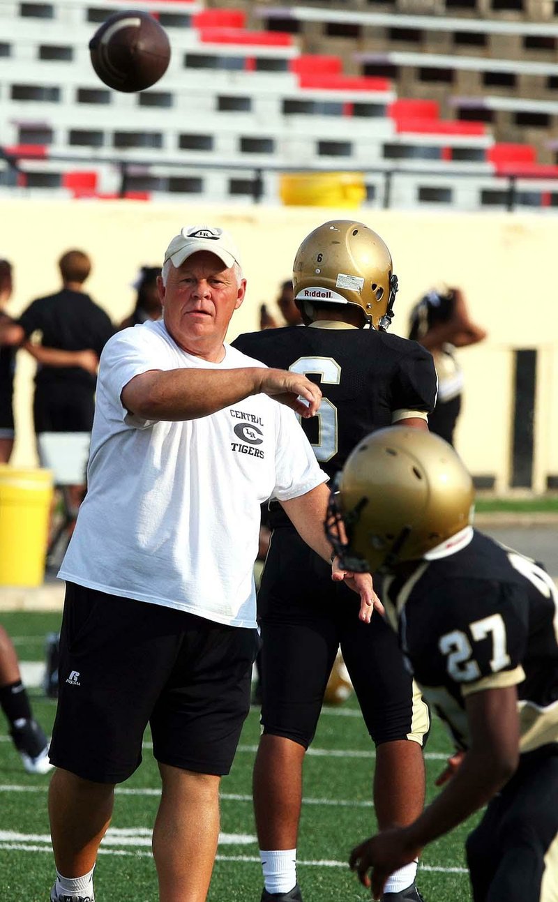 8/23/11
Arkansas Democrat-Gazette/STEPHEN B. THORNTON
 Central head Coach Ellis Register throws balls to his team prior to a  scrimage game Tuesday afternoon at Little Rock Central High School's Quigley Stadium.