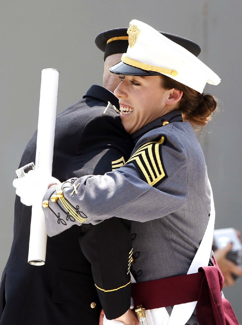 Kaitlyn Kelly reacts after receiving her diploma at the graduation and commissioning ceremony Saturday of the U.S. Military Academy in West Point, N.Y. 