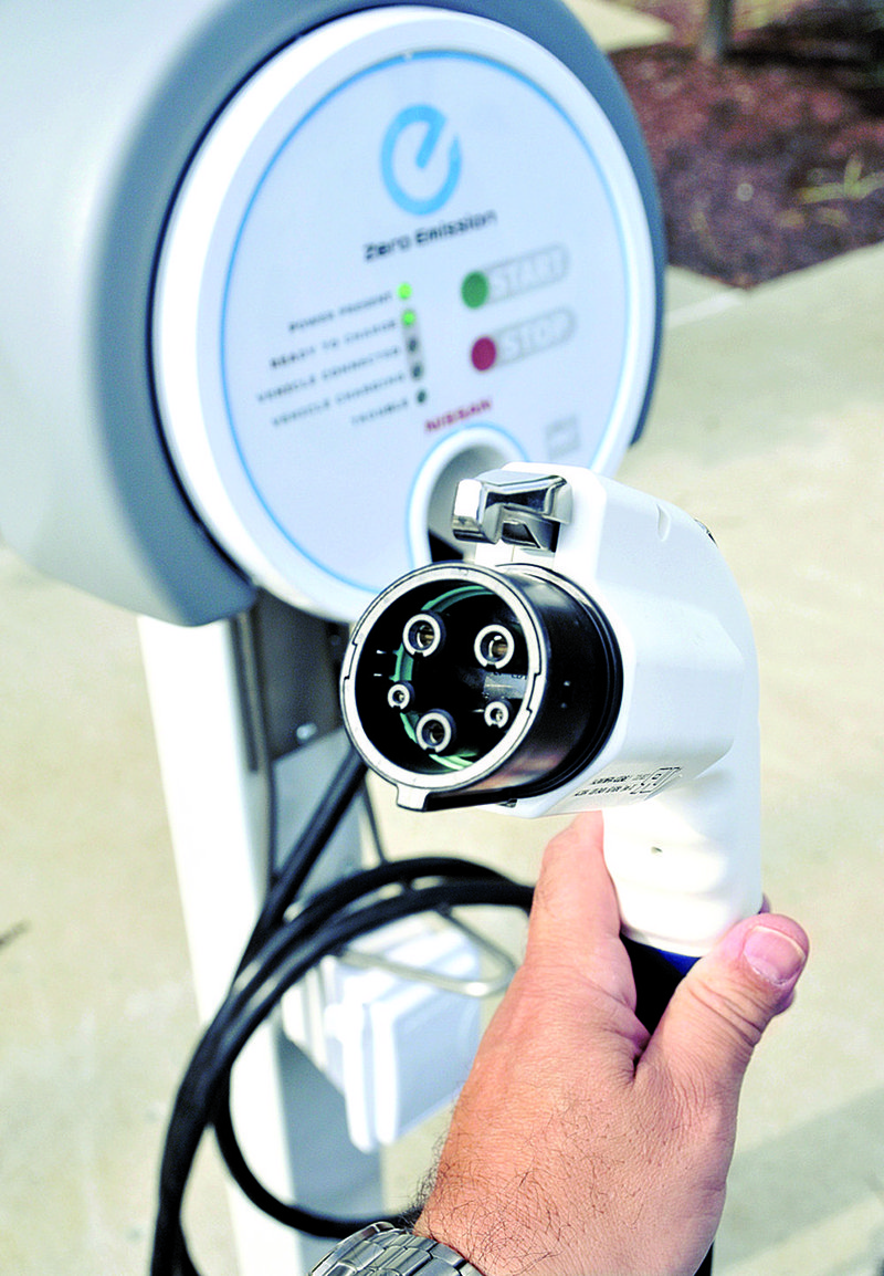 A 220-volt charging plug for electric cars is displayed outside Nissan’s U.S. headquarters in Franklin, Tenn., in this file photo. 