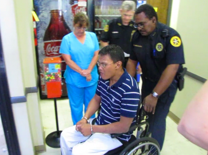 Russell Johnston is escorted out of the Faulkner County Courthouse after pleading no contest to four counts of first-degree murder Tuesday.
