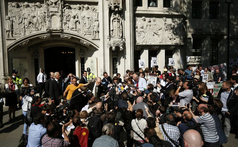 Gareth Peirce, center, the solicitor of WikiLeaks founder Julian Assange, who did not appear at court, speaks to the media after the verdict was given in his extradition case at the Supreme Court in London, Wednesday, May 30, 2012.