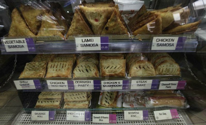 Pasties for sale are seen at a pasty shop in central London,Tuesday, May, 29, 2012.  Britain's government has cooled on its plan to impose a new sales tax on hot savory snacks, such as the humble Cornish pasty and sausage roll, after being criticized for unfairly attacking the poor. (AP Photo/Lefteris Pitarakis)