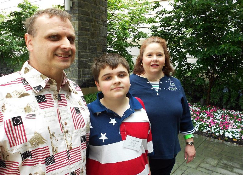 Trevor Paulsen, 12, of Harrisburg, stands with his parents William and Cynthia. Trevor competed in the 2012 Scripps National Spelling Bee.