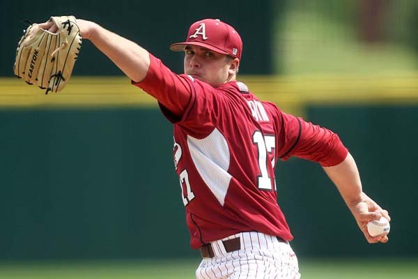 Arkansas starting pitcher Barrett Astin delivers against Kentucky Saturday, April 14, 2012 at Baum Stadium in Fayetteville.