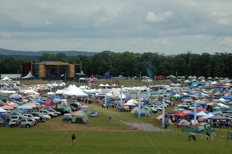 Crowds quickly fill the Mulberry Mountain event grounds, which is home to Wakarusa, on Thursday. It is the opening night of the annual music festival to run through Sunday.