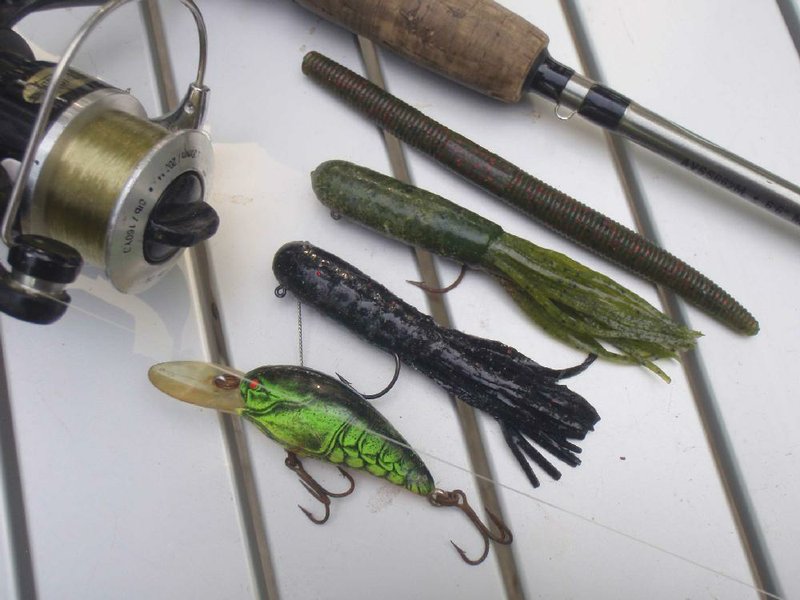 Good lures for smallmouth bass fishing include plastic worms (top), tube baits in dark colors (center) and crawdad-colored crank baits.      
