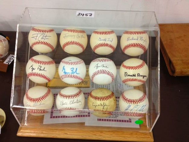 Baseballs signed by various U.S. presidents are among the items available at the Jennings Osborne estate auction.