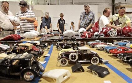 People check out some of about 2,000 items from the Jennings Osborne family offered at auction Saturday in North Little Rock. 