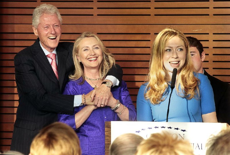 Chelsea Clinton will take part in a Global Youth Services Day at the Clinton Presidential Center on Friday. In this file photo, Clinton, with her father, former President Bill Clinton, and her mother, former Secretary of State Hillary Rodham Clinton, talks about an exhibit about her grandmothers during a preview Sunday at the Clinton Presidential Center in Little Rock. 