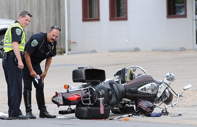 Members of the Fayetteville Police Department investigate the scene of a motorcycle accident Tuesday, June 12, 2012, on the eastbound lanes near the Stone Pony at 3615 Martin Luther King Jr. Blvd. in Fayetteville. 
