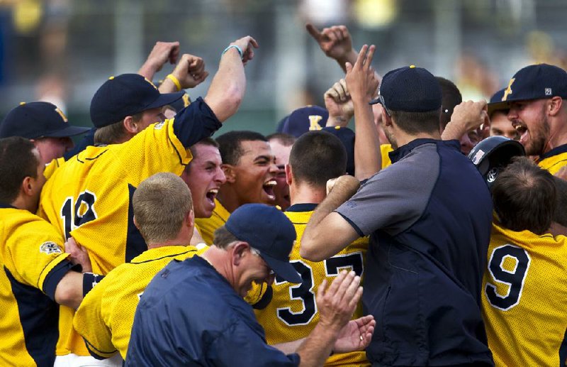 Kent State celebrates their 3-2  win over Oregon in an NCAA Super Regional Monday June 11, 2012  to advance to the College World Series.(AP Photo/The Oregonian,  Ross William Hamilton )