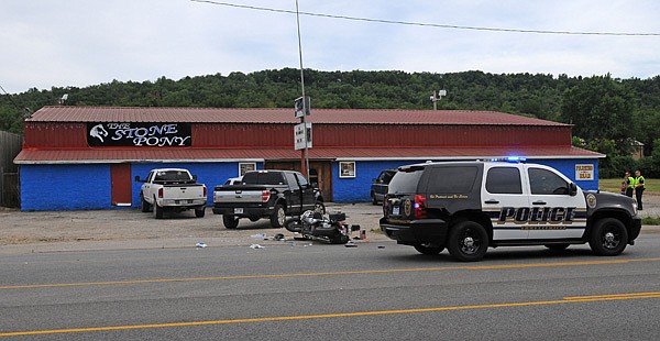 The Fayetteville Police Department investigates a motorcycle accident Tuesday at 3615 Martin Luther King Jr. Blvd. Rickey Lee Langham, 60, of Elkins was killed riding his motorcycle in the two-vehicle accident.