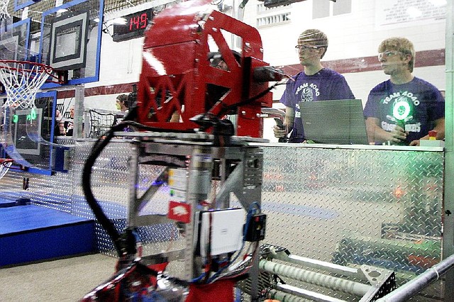 Arkansas Democrat-Gazette/WILLIAM MOORE
***NOTE TO EDITOR:  These guys where from Jonesboro, but where not affiliated with any particular high school in Jonesboro.  Just a bunch of kids that wanted to form a team.***
Alexander Laffoon (L) and Trey Bolzer, both 14 of Jonesboro, navigate their robot during the Inspiration and Recognition of Science and Technology robotics competition Friday, June 15, 2012 at Springdale High School.  The competition pitted teams of high school states from five states against each other.