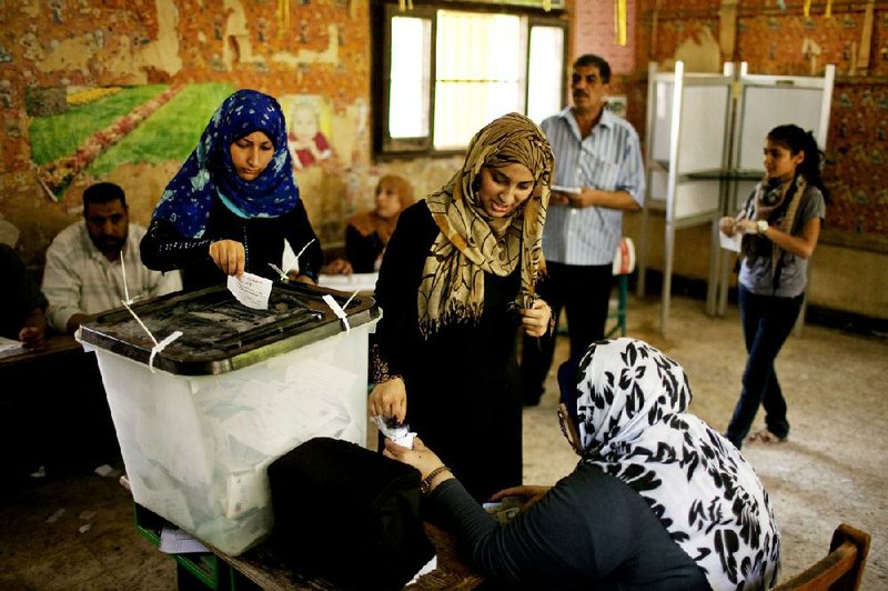 Egyptian women vote Saturday in Shubra El-Kheima, a working-class industrial area on the outskirts of Cairo. 