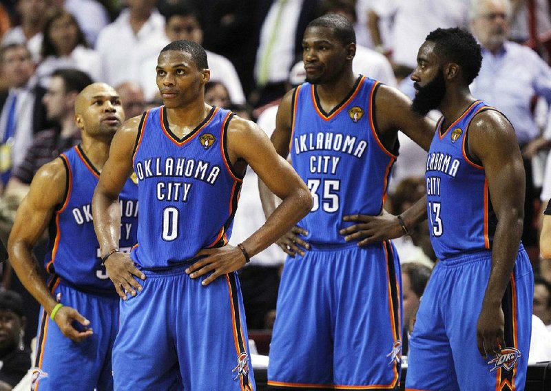 Oklahoma City Thunder players, Derek Fisher, Russell Westbrook, Kevin Durant, James Harden, from left, react at a break against the Miami Heat during the second half at Game 4 of the NBA finals basketball series, Tuesday, June 19, 2012, in Miami. The Heat won 104-98.  (AP Photo/Lynne Sladky)