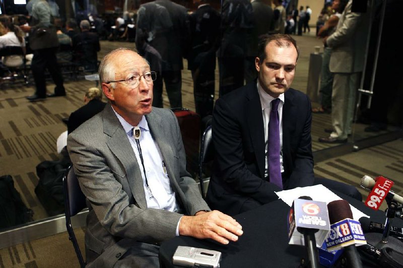 Interior Secretary Ken Salazar (left) and Bureau of Ocean Energy Management Director Tommy Beaudreau attend an oil leases auction Wednesday in New Orleans. 