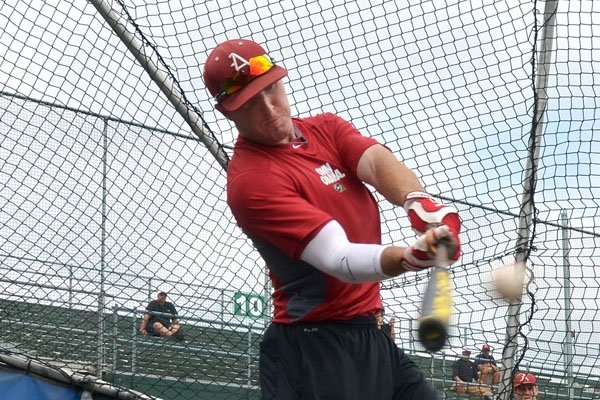 University of Arkansas batter Matt Vinson takes a cut during batting practice Wednesday afternoon in Ohama, Nebraska as the Razorbacks prepare for their next game in the 2012 College World Series.