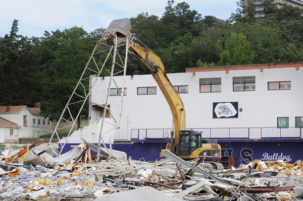 The old Fayetteville Boys & Girls Club building on Clinton Drive is torn down Wednesday by a wrecking crew. It most recently served Fayetteville Public Schools as an athletic training facility, but is being demolished to make room for an athletic complex.