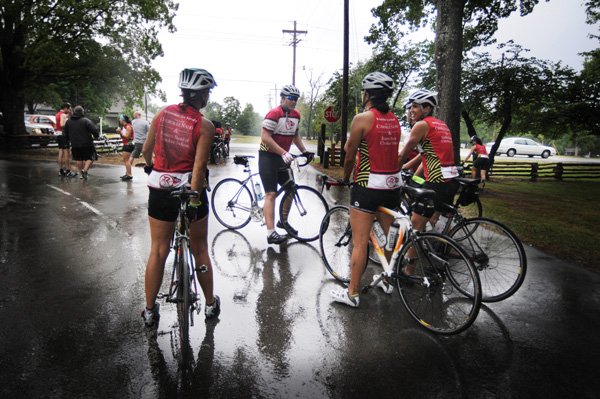 Chi Shipman, left, and Melissa Horn, second from right, listen to another rider in their group after stopping Thursday at Prairie Grove Battlefield Park. The group of Cherokees from seven states are biking the Remember the Removal ride, which started in Georgia on June 4 and retraces the Trail of Tears. The 1,000-mile ride ends in Tahlequah, Okla., the capital of the Cherokee Nation. 