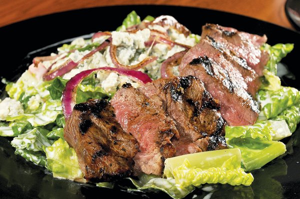The Bleu Cheese Steak Salad from the Tilted Kilt Pub and Eatery contains cooked-to-order steak on a bed of romaine lettuce and bleu cheese crumbles. The Irish/Scottish/American-themed restaurant opened earlier this year on Mall Avenue in Fayetteville. 