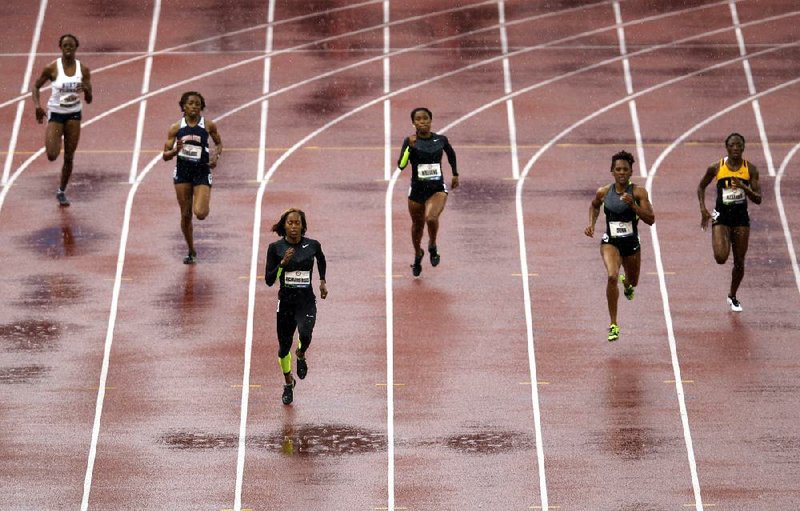 Sanya Richards-Ross leads the way in the women's 400m preliminary at the U.S. Olympic Track and Field Trials Friday, June 22, 2012, in Eugene, Ore. (AP Photo/Marcio Jose Sanchez)