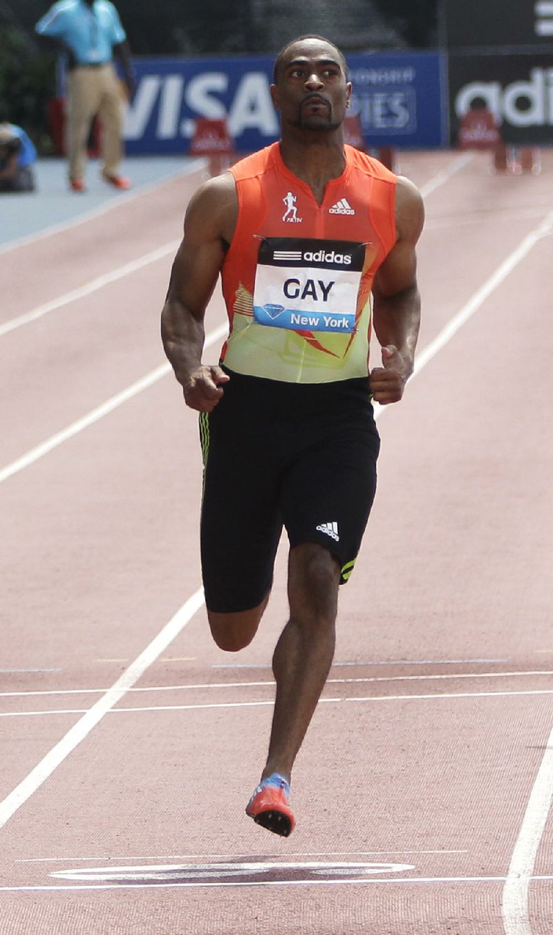Tyson Gay crosses the finish line ahead of the pack during the 100-meter B race at the Adidas Grand Prix track and field meet on Randall's Island, Saturday, June 9, 2012, in New York.  (AP Photo/Mary Altaffer)
