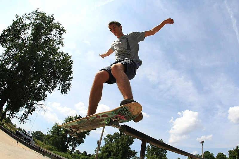 Arkansas Democrat-Gazette/ STATON BREIDENTHAL --6/21/12--  Reece Henderson performs a trick Thursday while skateboarding at Riverview Skatepark in North Little Rock. Yesterday was Go Skateboarding Day, held on June 21 every year since 2003. 