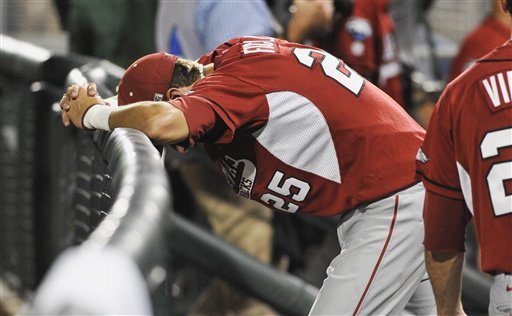 Arkansas' Dominic Ficociello (25) stands dejected after losing 3-2 to South Carolina in an NCAA College World Series baseball elimination game in Omaha, Neb., Friday, June 22, 2012. South Carolina won 3-2 and advances to play Arizona in the championship series. (AP Photo/Eric Francis)