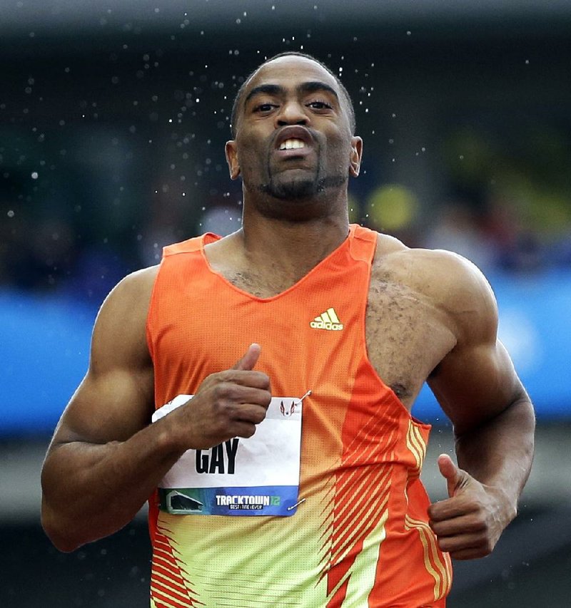 Tyson Gay leads in a men's 100m preliminary at the U.S. Olympic Track and Field Trials Saturday, June 23, 2012, in Eugene, Ore. (AP Photo/Eric Gay)