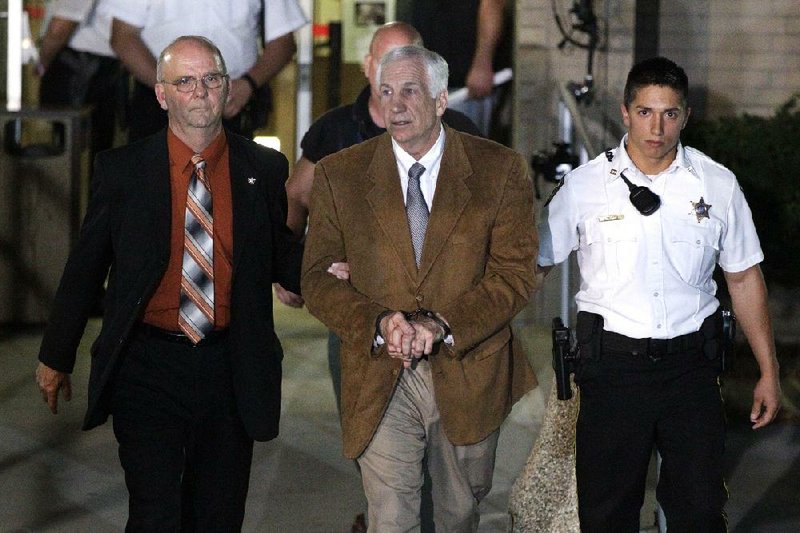 Lawyers for former Penn State assistant coach Jerry Sandusky (center) say they weren’t given enough time to prepare for their client’s child sex abuse trial. Sandusky was convicted Friday on 45 of 48 counts. 