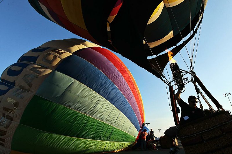 Arkansas Democrat-Gazette/BENJAMIN KRAIN --06/23/12--
Nate Abel, from Ft. Worth, TX, prepares his balloon for flight Saturday morning in Maumelle during a piloting competition with about a dozen other balloonists from all over the country. The balloons are participating in various events through Sunday as part of the Great War Memorial Balloon Race.
MORE PHOTOS ONLINE