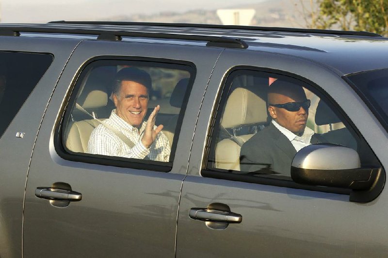 Mitt Romney arrives by motorcade Friday for a private dinner at a weekend donors conference in Park City, Utah. 