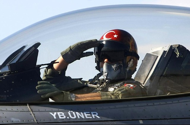In this April 29, 2010 file photo, a Turkish pilot salutes before take-off at an air base in Konya, Turkey. Turkish President Abdullah Gul said Saturday June 23, 2012, his country would take "necessary" action against Syria for the downing of a Turkish military jet, but suggested that the aircraft may have unintentionally violated the Syrian airspace. The plane went down in the Mediterranean Sea about 8 miles (13 kilometers) away from the Syrian town of Latakia, Turkey said. (AP Photo/File)