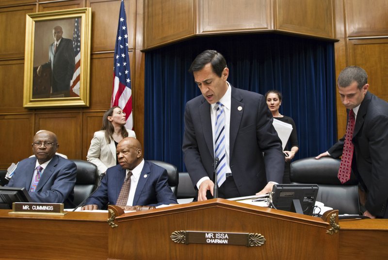 Chairman Darrell Issa, R-Calif., center, adjourns a meeting of the House Oversight and Government Reform Committee, after a committee vote to hold Attorney General Eric Holder in contempt of Congress, on Capitol Hill in Washington, Wednesday, June 20, 2012. Rep. Edolphus Towns, D-N.Y., sits at far left, and Rep. Elijah Cummings, D-Md., the ranking member, watches, second from left. In a showdown with President Barack Obama’s administration, House Republicans had pressed for more Justice Department documents on the flawed gun-smuggling probe known as Operation Fast and Furious that resulted in hundreds of guns illicitly purchased in Arizona gun shops winding up in the hands of Mexican drug cartels. 