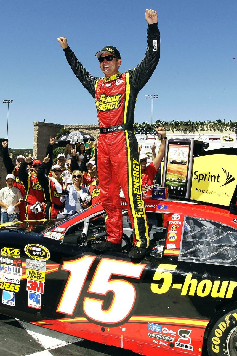 Clint Bowyer celebrates after winning the NASCAR Sprint Cup Toyota/Save Mart 350 on Sunday afternoon in Sonoma, Calif., after holding off Kurt Busch. 